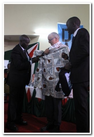 mr.birgen and mr.kiprono bryan making daad director an elder during the launch